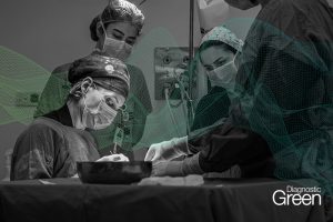 nurses gathered around stitched area of patient