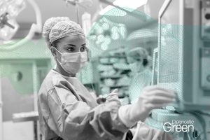 nurse checking vitals on screen