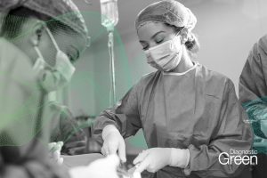 nurse assisting surgical procedure